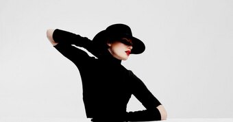 Who popularized the little black dress in Paris?